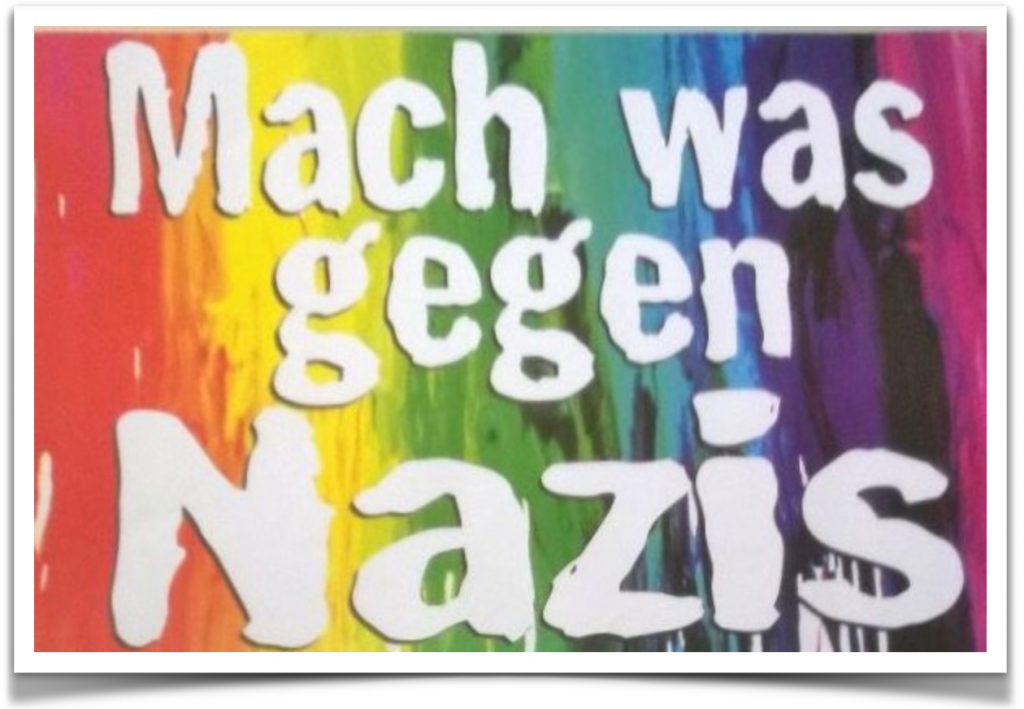 Abbildung zeigt: Auf regenbogenfarbigem Hintergrund 'Mach was gegen Nazis'